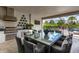 Outdoor kitchen with dining area and pool view at 1039 Jack Nicklaus Ct, Kissimmee, FL 34747