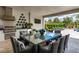 Outdoor kitchen with dining area and pool view at 1039 Jack Nicklaus Ct, Kissimmee, FL 34747
