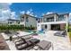 Resort-style backyard with a large pool, spa, and fire pit at 1039 Jack Nicklaus Ct, Kissimmee, FL 34747