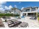 Modern home with a beautiful pool, patio, and lounge chairs at 1039 Jack Nicklaus Ct, Kissimmee, FL 34747