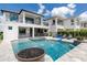 Stunning pool and spa with water features and fire pit at 1039 Jack Nicklaus Ct, Kissimmee, FL 34747