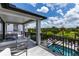 Relaxing balcony overlooking the pool and a scenic landscape at 1039 Jack Nicklaus Ct, Kissimmee, FL 34747