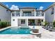 Stunning pool and spa with water features and lounge area at 1039 Jack Nicklaus Ct, Kissimmee, FL 34747