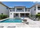 Inviting pool and spa with water features and lounge area at 1039 Jack Nicklaus Ct, Kissimmee, FL 34747