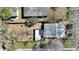Overhead view of the home showcasing the backyard and surrounding trees at 105 N Ortman Dr, Orlando, FL 32805