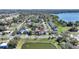 Aerial view of home near lake with city skyline in the distance at 105 N Ortman Dr, Orlando, FL 32805