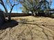 A view of the backyard with several trees at 105 N Ortman Dr, Orlando, FL 32805