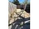 An empty and shaded patio area in a fenced backyard at 105 N Ortman Dr, Orlando, FL 32805