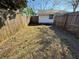 Spacious backyard enclosed by a wood fence at 105 N Ortman Dr, Orlando, FL 32805