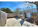 Fenced backyard area featuring a concrete patio with an access gate at 105 N Ortman Dr, Orlando, FL 32805