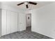 Bedroom features tile flooring, a ceiling fan and a closet for storage at 105 N Ortman Dr, Orlando, FL 32805