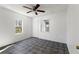 Light and bright bedroom with tile flooring, a ceiling fan and natural light at 105 N Ortman Dr, Orlando, FL 32805