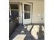 Exterior doorway with partial patio at 105 N Ortman Dr, Orlando, FL 32805
