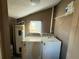 Laundry room area with washer, dryer, and water heater at 105 N Ortman Dr, Orlando, FL 32805