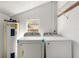 Functional laundry room with modern washer, dryer, and water heater at 105 N Ortman Dr, Orlando, FL 32805