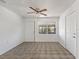 Light filled area with tile floor, ceiling fan, and view of the outdoors at 105 N Ortman Dr, Orlando, FL 32805