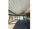 Screened porch featuring outdoor space with a lake view at 105 N Ortman Dr, Orlando, FL 32805