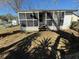Covered and screened front porch for outdoor relaxation at 105 N Ortman Dr, Orlando, FL 32805