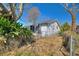 Side view of home with fenced yard and access gate at 105 N Ortman Dr, Orlando, FL 32805