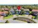 Aerial view of the home in a beautiful community with manicured lawns and paver driveways at 10680 Royal Cypress Way, Orlando, FL 32836