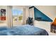 Bedroom with blue and orange accent walls and a workspace at 10680 Royal Cypress Way, Orlando, FL 32836