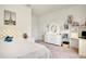 Bright bedroom with plush bed, built-in shelving, and vanity at 10680 Royal Cypress Way, Orlando, FL 32836