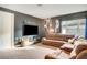 Home theater room features a large TV and comfortable seating at 10680 Royal Cypress Way, Orlando, FL 32836
