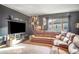 Spacious home theater with large sectional sofa and media wall at 10680 Royal Cypress Way, Orlando, FL 32836