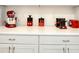Kitchen counter with red and white themed appliances at 10680 Royal Cypress Way, Orlando, FL 32836