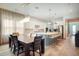Open kitchen and dining area with modern light fixtures at 10680 Royal Cypress Way, Orlando, FL 32836