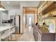 Modern kitchen with a built-in bar and wine cooler at 10680 Royal Cypress Way, Orlando, FL 32836