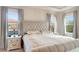 Luxurious main bedroom with king-size bed and elegant decor at 10680 Royal Cypress Way, Orlando, FL 32836