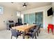 Outdoor patio with dining table and grill at 10680 Royal Cypress Way, Orlando, FL 32836