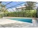 Relaxing screened-in pool with tiled deck at 10680 Royal Cypress Way, Orlando, FL 32836