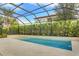 Inviting screened-in pool with a tiled deck at 10680 Royal Cypress Way, Orlando, FL 32836