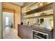 Built-in bar with wine cooler and glass shelving at 10680 Royal Cypress Way, Orlando, FL 32836