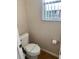 Clean bathroom with toilet and single vanity at 1128 S Beach Cir, Kissimmee, FL 34746