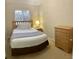 Comfortable bedroom with a double bed, nightstand, and a dresser at 1128 S Beach Cir, Kissimmee, FL 34746