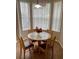 Cozy breakfast nook with a round table and four chairs, perfect for enjoying morning meals at 1128 S Beach Cir, Kissimmee, FL 34746
