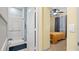 Bathroom with shower,grab bars and tiled walls at 11412 Chateaubriand Ave, Orlando, FL 32836