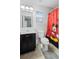 Clean bathroom with a Mickey Mouse shower curtain at 11412 Chateaubriand Ave, Orlando, FL 32836