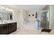 Bathroom boasts a soaking tub, double vanity, and walk-in shower at 11412 Chateaubriand Ave, Orlando, FL 32836