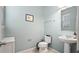 Small powder room with pedestal sink at 11412 Chateaubriand Ave, Orlando, FL 32836