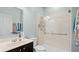 Bathroom with walk-in shower,grab bars and vanity at 11412 Chateaubriand Ave, Orlando, FL 32836