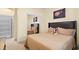 Bedroom with double bed and mirrored closet doors at 11412 Chateaubriand Ave, Orlando, FL 32836