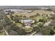 Aerial view of community pool, clubhouse and green space at 11412 Chateaubriand Ave, Orlando, FL 32836