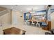 Open concept dining area with a built-in bench and table at 11412 Chateaubriand Ave, Orlando, FL 32836