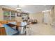 Dining area with a rustic wooden table and built-in bench at 11412 Chateaubriand Ave, Orlando, FL 32836