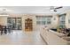 Gathering room with beige sofa and access to backyard at 11412 Chateaubriand Ave, Orlando, FL 32836