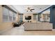 Gathering room with sectional sofa and built in shelving at 11412 Chateaubriand Ave, Orlando, FL 32836